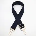 Detail of adjustable dark blue and black woven shoulder strap with gold metal lobster clasps - Silver Clasp / Black and Blue (No. 31) / [product Attributes] This Product Is A [dark Blue And Black Interwoven] [woven Replacement Bag Strap] With A Fine [geometric Interlaced Texture]. The Material Appears To Be [high-density Polyester] Equipped With [light Gold Metal Hardware] Including Two [rotating Lobster Buckles] And One [adjustable Buckle] Suitable For Various Women's Bag Modifications. [visual Presentation] The Image Uses A [pure White Background Flat Display] With The Bag Strap Crisscrossed And Centered Creating A Balanced Composition. Image Quality Is [high] With Clear Focus And Realistic Reproduction Of The Metallic Texture. Aesthetics Are [high] With An Overall Score Of [8.2] Visually Unified And Free Of Distracting Elements. [text Content] Reported By Group: To_remove Contains The Overlaid Chinese Characters "31" In The Upper Left Corner; The Other Groups Are Empty; It Is Recommended To Remove This Item Number Information To Improve Visual Clarity. [logistics Tags] None. [infringement Risk] Product Infringement: No Risk. Background Infringement: None. [product Parameters] The Image Shows An Adjustable Long Shoulder Strap Design With Hardware But No Specific Numerical Markings.