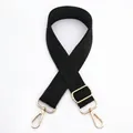 Detail view of adjustable black wide shoulder strap with golden metal lobster clasps - Black