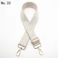 Close-up of beige woven geometric pattern strap with polished gold lobster clasps - Silver Clasp / Creamy White (No.33)