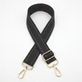 Detail of adjustable black and grey herringbone woven strap with golden metal hardware hooks - Dark Gray