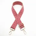 Detail showing red and white geometric woven strap with gold metal lobster clasps - Silver Clasp / Red (No. 36) / 【product Attributes】: Visually This Appears To Be An Ethnic-style Geometric Woven Bag Strap. It Features A Red And White Diagonal Woven Design Creating A Strong Visual Rhythm. Both Ends Are Fitted With Gold Metal Carabiners (lobster Buckles) And The Middle Has A Matching Adjustable Buckle. The Structure Is Sturdy And It Appears To Be Made Of A Polyester-cotton Blend Suitable For Replacing Or Modifying Various Bags. 【visual Presentation】: The Image Is Displayed Against A Pure White Background With A Neat Layout. Image Quality Is [high] With Good Detail And Well-presented Woven Texture And Metallic Sheen. Aesthetic Appeal Is [medium] Overall Score [7.5]. The Main Issue Is The Overly Monotonous Background Lacking A Sense Of Context And Failing To Showcase The Product's Refined Accessory Attributes. 【text Content】: The "to_remove" Group Includes The Chinese Label "36" In The Upper Left Corner Which Is Internal Product Number Information And Should Be Removed. There Is No Other Text Content. 【logistics Label】: None. 【infringement Risk】: The Product's Appearance Is A Standard Woven Pattern Without Specific Brand Markings Therefore It Is Deemed "none". 【product Parameters】: Red And White Color Scheme Woven Texture Gold Alloy Buckles Adjustable Design.