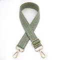 Detail of light green woven bag strap with white chevron pattern and gold metal hooks - Matcha Green