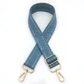 Close-up of No. 12 blue chevron woven bag strap with adjustable gold lobster clasp - Silver Clasp / Lake Blue