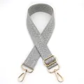 Detail of grey herringbone pattern adjustable strap with gold-tone metal hooks - Light Gray
