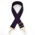 Close-up of purple woven shoulder strap with gold metal hooks and adjustable buckle - Purple
