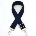 Detail view of navy blue woven fabric bag strap with golden metal swivel lobster clasps - Blue