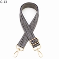 Detail of adjustable bag strap with black and white chevron pattern and gold hardware - Herringbone (C-13) / Silver Clasp / Navy Blue