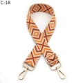 Detail of adjustable crossbody strap with orange geometric jacquard pattern and gold buckle - Khaki Orange (C-18)