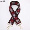 Détail d'une bandoulière en jacquard rouge, noir et blanc avec boucles dorées - Rouge Noir (A-33)