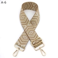 Detailed view of the gold-tone adjustable buckle on a geometric patterned bag strap - A-6 Brown Khaki