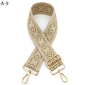 Close-up of wide woven shoulder strap with khaki geometric patterns and gold metal buckles - Silver Clasp / A-9 Khaki