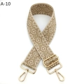 Close-up of woven bag strap with golden geometric pattern and polished metal lobster clasps - Silver Clasp / A-10 Deep Khaki