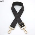 Detail of adjustable black bag strap with embossed Greek key pattern and gold metal hooks - Dark Gray (W35)