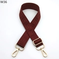 Close-up of adjustable wine red bag strap with Greek key pattern and gold metal buckles - Brick Red (W36)