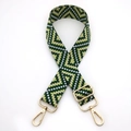 Close-up of green and yellow geometric woven shoulder strap with gold metal hooks - No. 8 Green