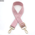 Detail of pink woven bag strap with geometric jacquard pattern and golden metal buckles - Lotus Pink (W40)