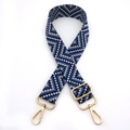 Detail of adjustable woven bag strap with blue geometric patterns and gold metal hooks - Blue (No. 9)