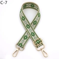 Detail of green and white geometric jacquard bag strap with gold metal lobster clasps - C-7 Green