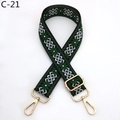 Close-up of geometric ethnic pattern bag strap with golden lobster hooks and buckle - C-21 Black Emerald Green
