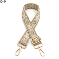 Close-up of ethnic style embroidered bag strap with floral patterns and gold hooks - Q-9 Khaki White