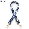 Close-up of adjustable woven bag strap with blue leaf pattern and gold metal hardware - No.8 Lake Blue
