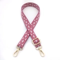 Detail of adjustable bohemian pink rhombus patterned woven strap with gold metal hardware - Rose Red