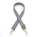Detail of adjustable rhombus pattern bag strap with golden metal hooks and buckles - Gray