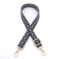 Close-up of geometric diamond pattern shoulder strap with gold metal lobster clasps - Dark Gray