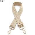 Detail of beige woven strap with chevron pattern and adjustable gold metal buckles - Silver Clasp / Light Khaki