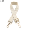 Detail showing adjustable wide jacquard woven strap with golden lobster clasps and beige chevron - Silver Clasp / Beige