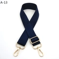 Detail of navy blue nylon bag strap with gold lobster clasps and herringbone pattern - Silver Clasp / Blue