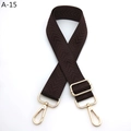 Close-up of brown herringbone woven strap with gold metal hooks and adjustable buckle - Silver Clasp / Brown