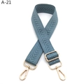 Detail view of grey-blue chevron woven bag strap with adjustable gold buckle and swivel hooks - Silver Clasp / Lake Blue