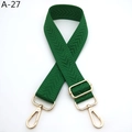 Close-up of green herringbone woven bag strap with adjustable gold-tone metal buckles - Silver Clasp / Emerald Green