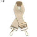 Close-up of beige chevron pattern woven strap with adjustable gold metal buckle - Light Khaki