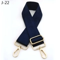 Detail view of navy blue chevron patterned bag strap with golden metal swivel hooks - Blue