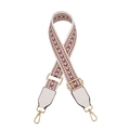 Close-up of adjustable woven shoulder strap with gold metal hooks and white faux leather - White