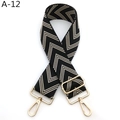 Detail view of the geometric arrow pattern webbing and gold metal buckle on adjustable strap - Black Beige (A-12)
