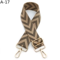 Close-up of adjustable woven shoulder strap with khaki chevron pattern and gold metal hooks - Khaki Black (A-17)