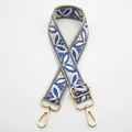 Detail of adjustable ethnic style bag strap with blue leaf pattern and gold hardware - Style 19 Beige Lake Blue