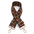 Close-up of ethnic embroidered bag strap with floral pattern and golden metal hardware - No. 3 Black Red Orange Floral / Silver Clasp