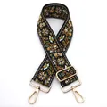 Close-up of ethnic embroidered bag strap with yellow floral patterns and gold metal clips - No. 11 Black Light Brown Floral