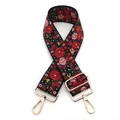 Close-up of vintage ethnic floral embroidery on adjustable black wide bag strap - No. 13 Black Rose Pink Floral