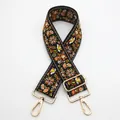 Close-up of bohemian embroidered strap with floral patterns and gold metal buckles - No. 14 Black Yellow Orange Floral