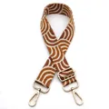 Detail view of brown and white wavy pattern woven bag strap with golden metal hooks - No.10 Brown Multi Plaid