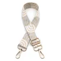 Close-up of wide jacquard strap with cream gray abstract patterns and gold metal buckles - No.20 Silver Silk Off-white
