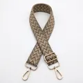 Detail view of 3.8cm wide woven bag strap No. 8 with herringbone pattern and gold hardware - Dark Khaki