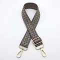 Detail of 3.8cm wide adjustable nylon strap with gold metal hooks and herringbone pattern - Dark Gray