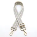 Close-up of adjustable cream and silver shoulder strap with polished gold metal buckles - Rice White No.16