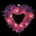Pink heart-shaped tinsel wreath with warm LED lights for Valentine party decoration - Pink Heart Wreath With Warm Yellow Lights